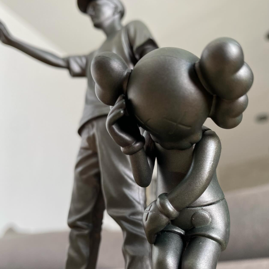 Limited-edition KAWS “Partners Grey” figurine of 500, painted
